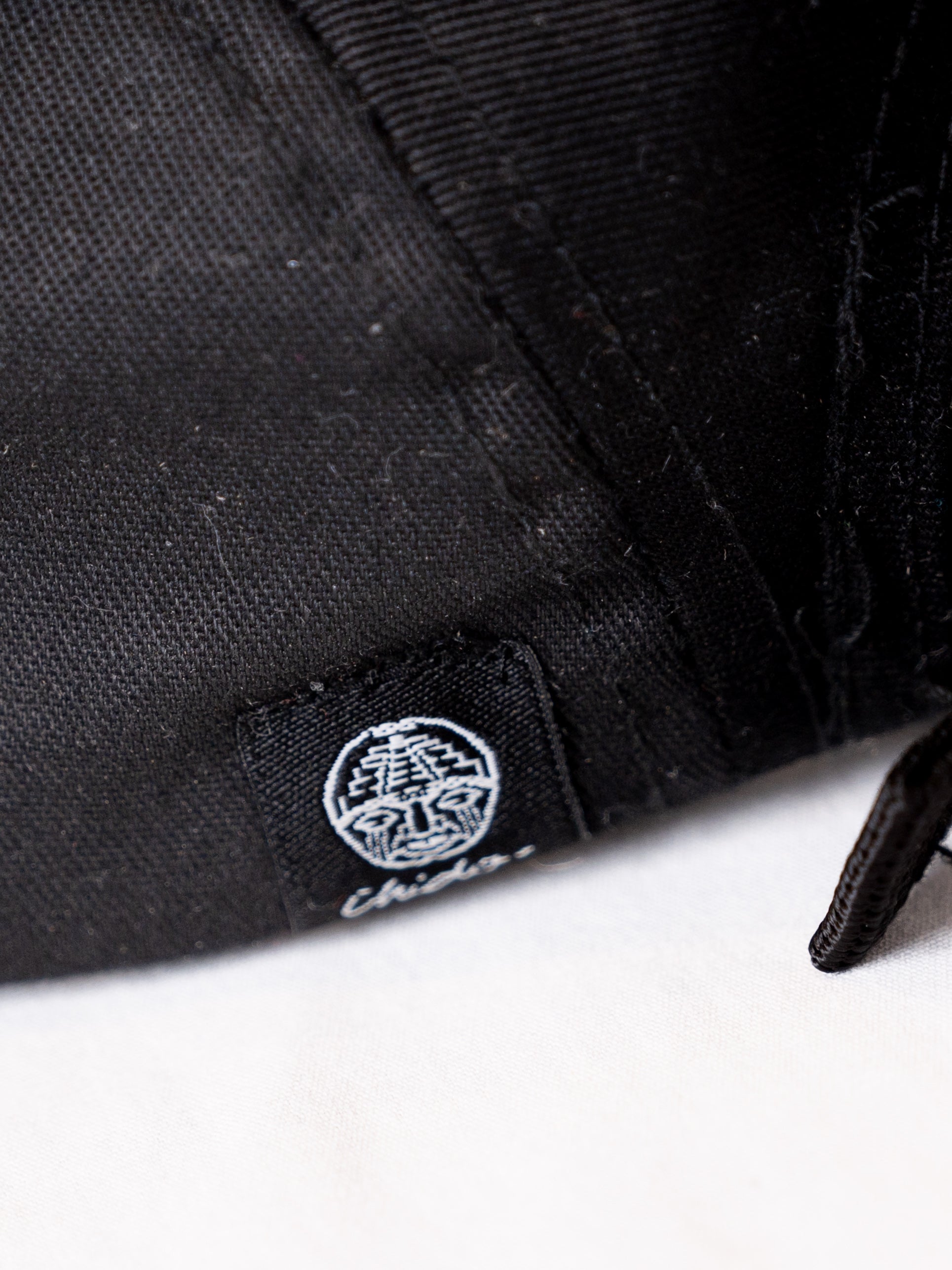 Black 5-panel cap. Chido