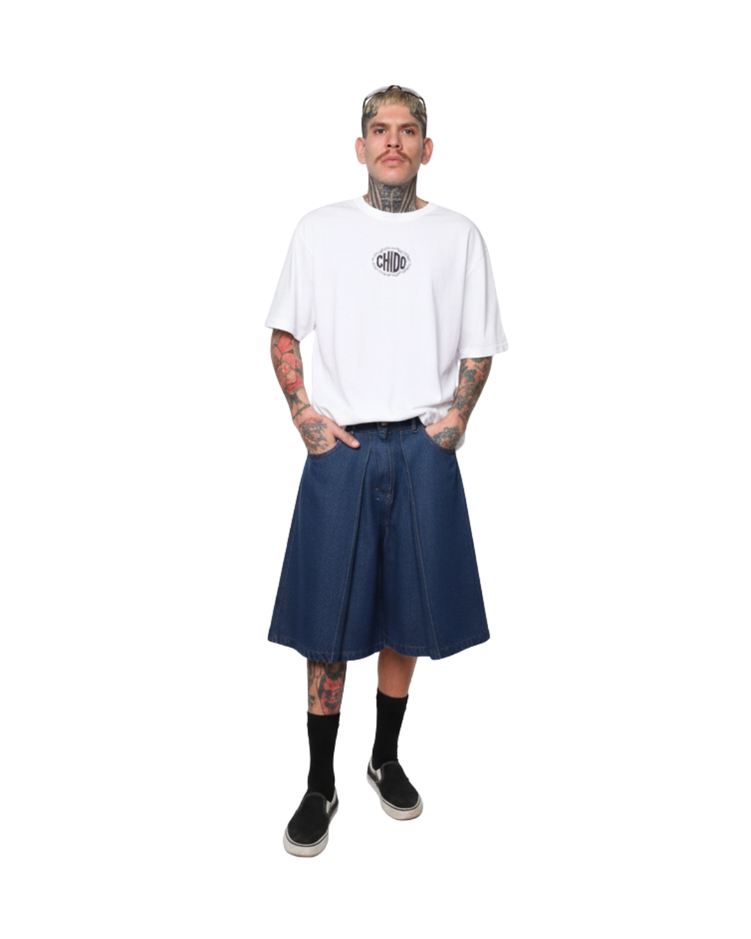 Model wearing white CHIDO t-shirt and oversized denim bermuda Mexican streetwear outfit