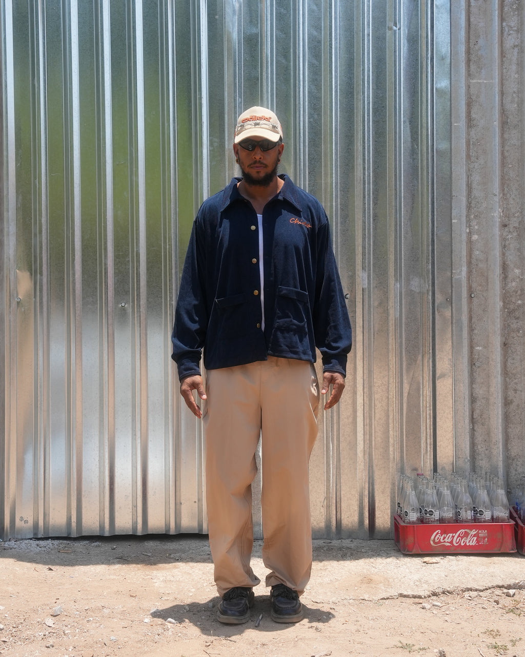 Model wearing CHIDO navy corduroy chore jacket made in Mexico