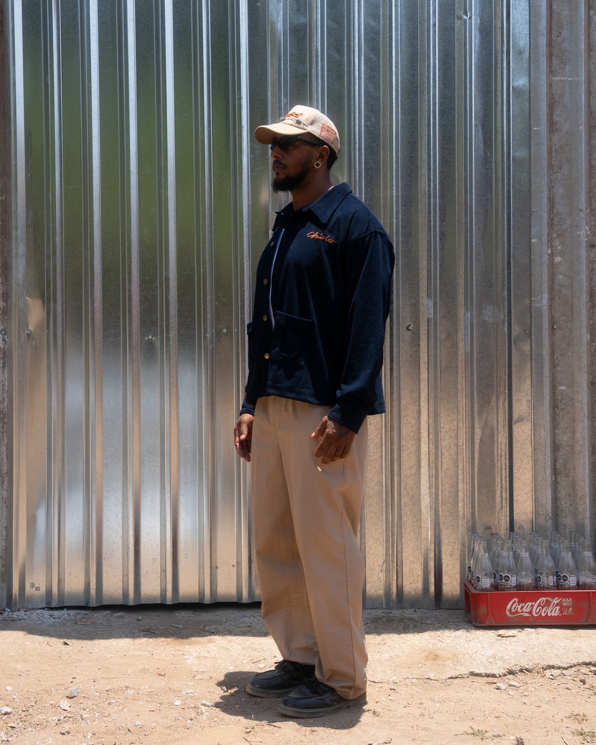 Side view of CHIDO navy corduroy chore jacket on model